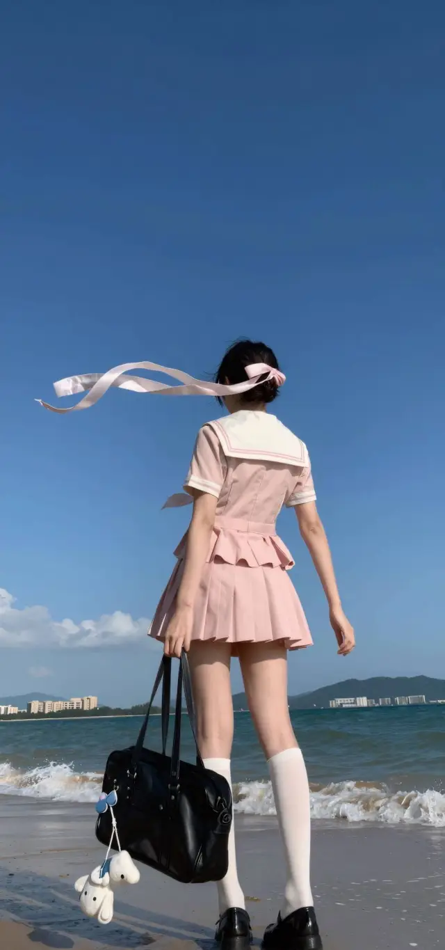 粉色水手服海边粉丝带背影美女手机壁纸